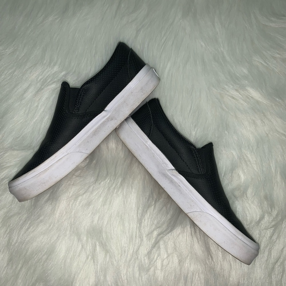 Black Vans slip ons